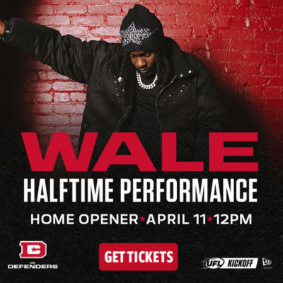Promotional graphic for Wale halftime performance with bold red text and artist against a brick wall.
