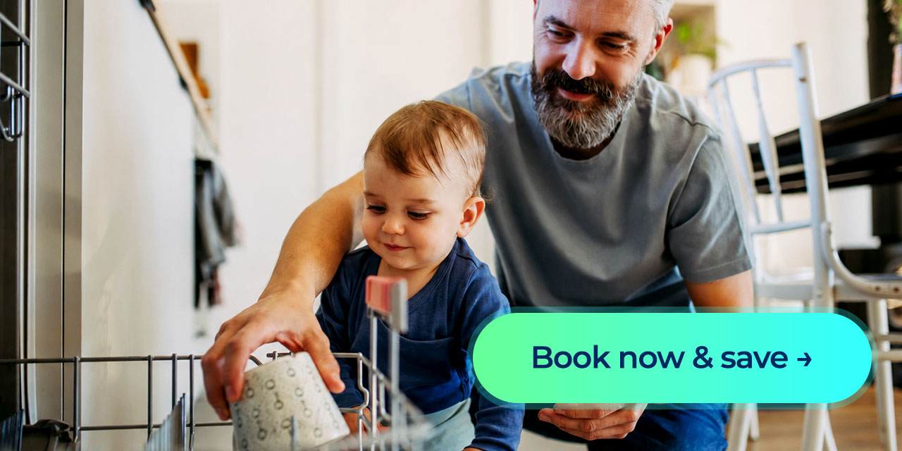 Father and baby load a dishwasher together with a “Book now & save” button.
