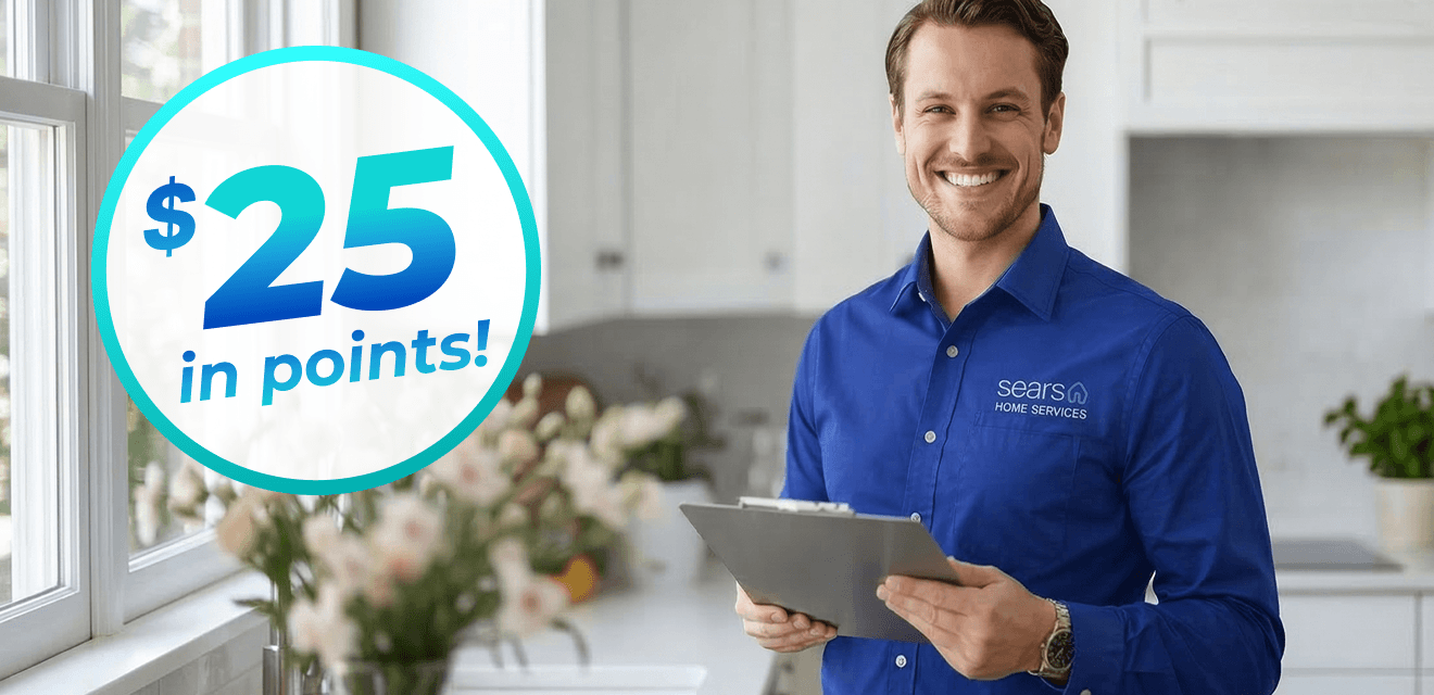 $25 in points! A Sears Home Service technician standing in a spring themed kitchen holds a clip board and smiles.