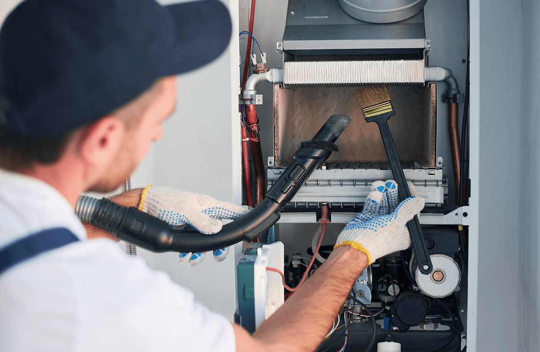 A Sears technician checking out a furnace