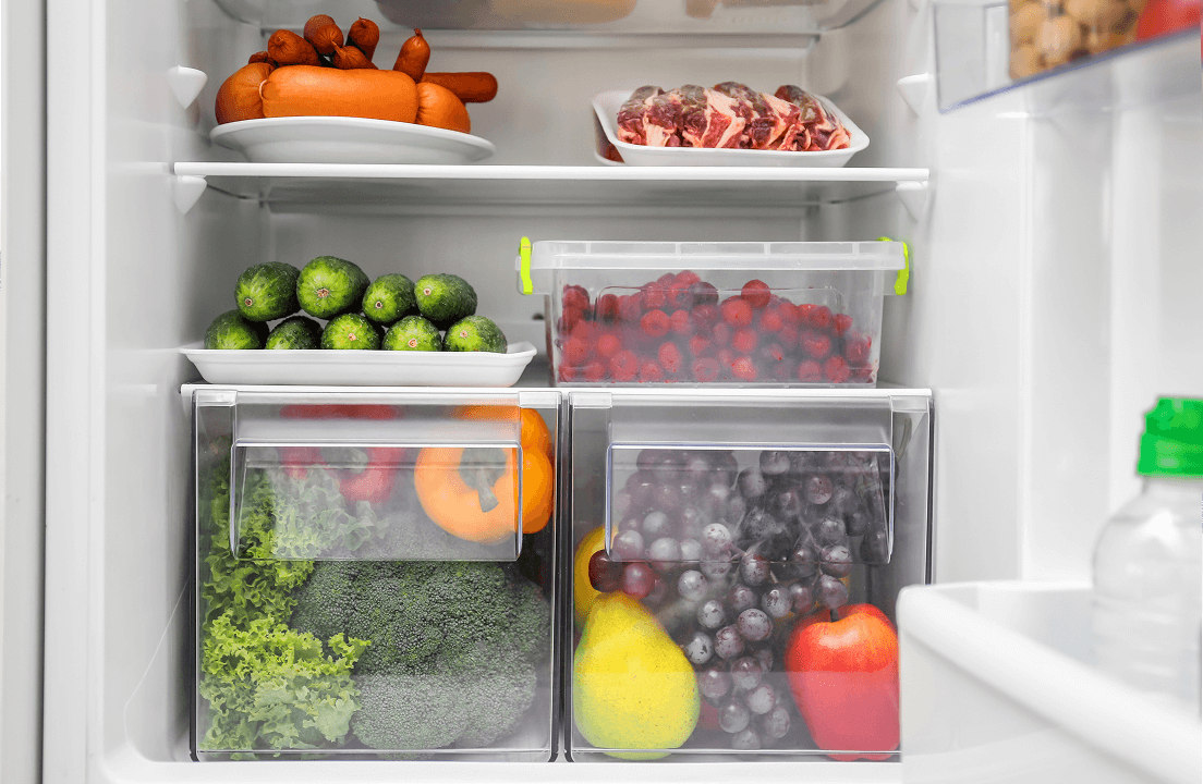 A fridge that has fruits, vegetables, meat and cheeses