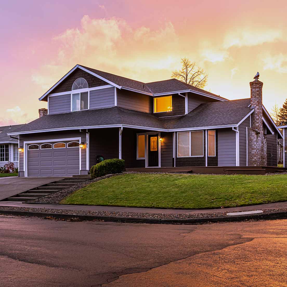 A side view of a suburban house during sunset