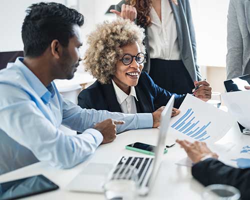 Multiple Business People Presenting to a Woman at the Center
