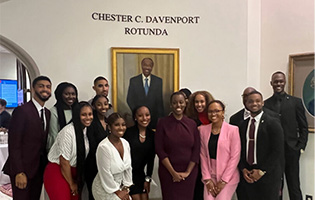 CeCe Davenport and School of Law students with Chester Davenport’s portrait.