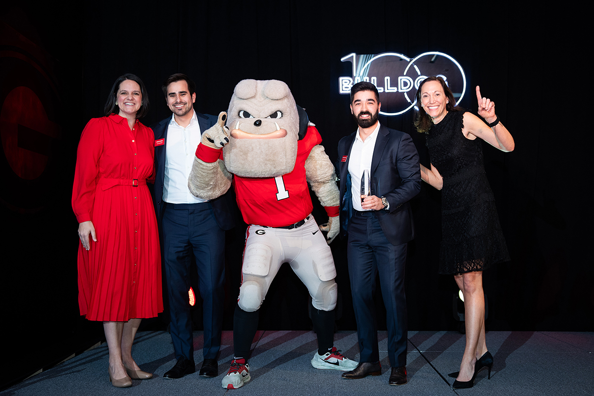 From left to right, VP for Development and Alumni Relations Jill S. Walton, CFO of Altera Investments Carlos Alcala, Hairy Dawg, CEO of Altera Investments David Fershteyn, and UGA alumni president Lee Zell. Altera Investments was named the 2024 No. 1 Bulldog 100 business during the program’s 15th annual celebration Feb. 9 in Sanford Stadium. (Photo by Decisive Moment Photography)