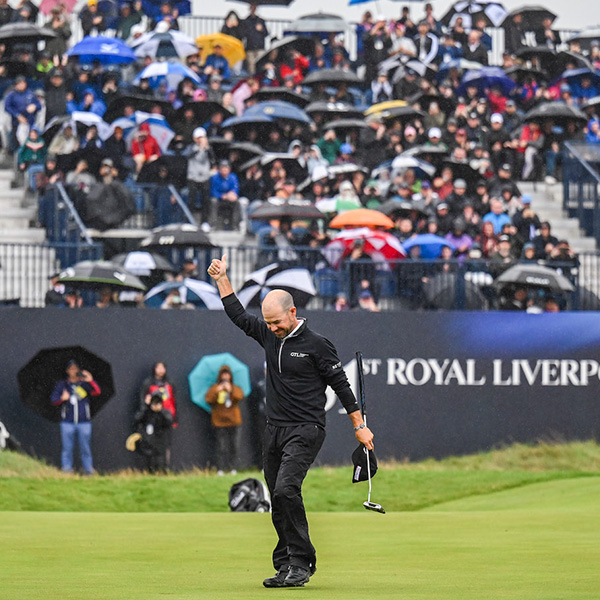 Brian Harmon celebrates on the golf course after a win