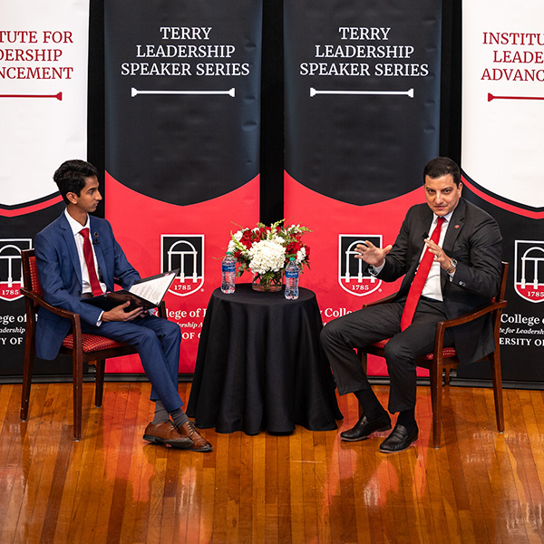 A student interviews Paul Shoukry on the stage of The UGA Chapel