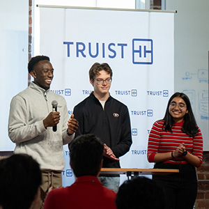 Terry students standing in front Truist banners