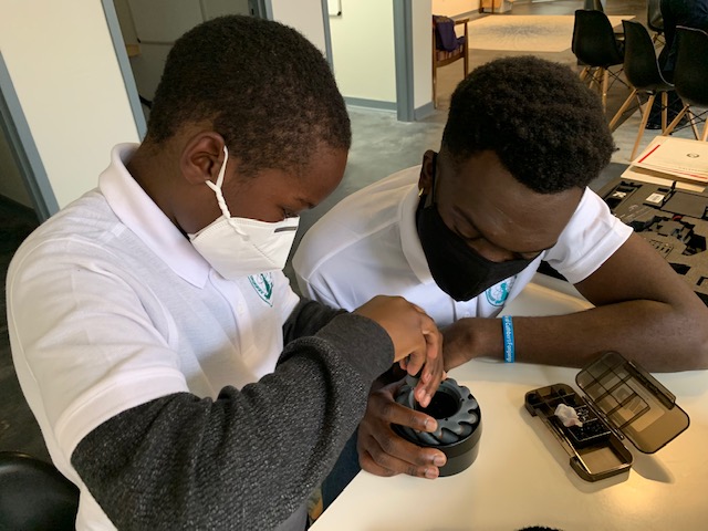 UGA Campus News UGA receives national diveUGA engineering student Cuthbert Fonjungo (right) works with Hilsman Middle School student Christopher Chatmon through the Pawn Accelerator program