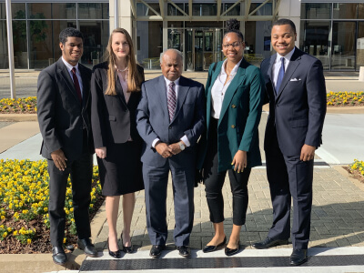 The inaugural class of Benham Scholars with Georgia Supreme Court Justice Robert Benham from the 2018-19 academic year. Posing with Benham (center) are former law students (from left) Sharod McClendon, Hillary Davis, Janay Alexander and Justin Edge. 