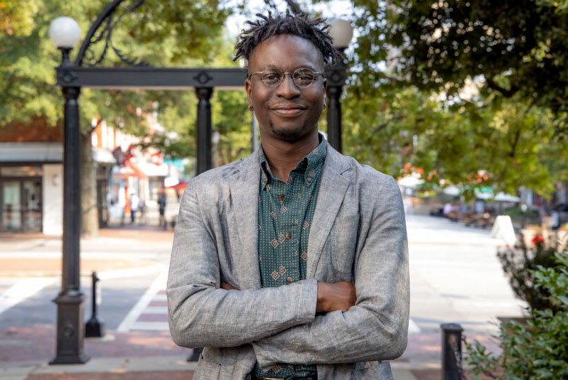 Portrait of Joshua Williams in front of UGA Arch