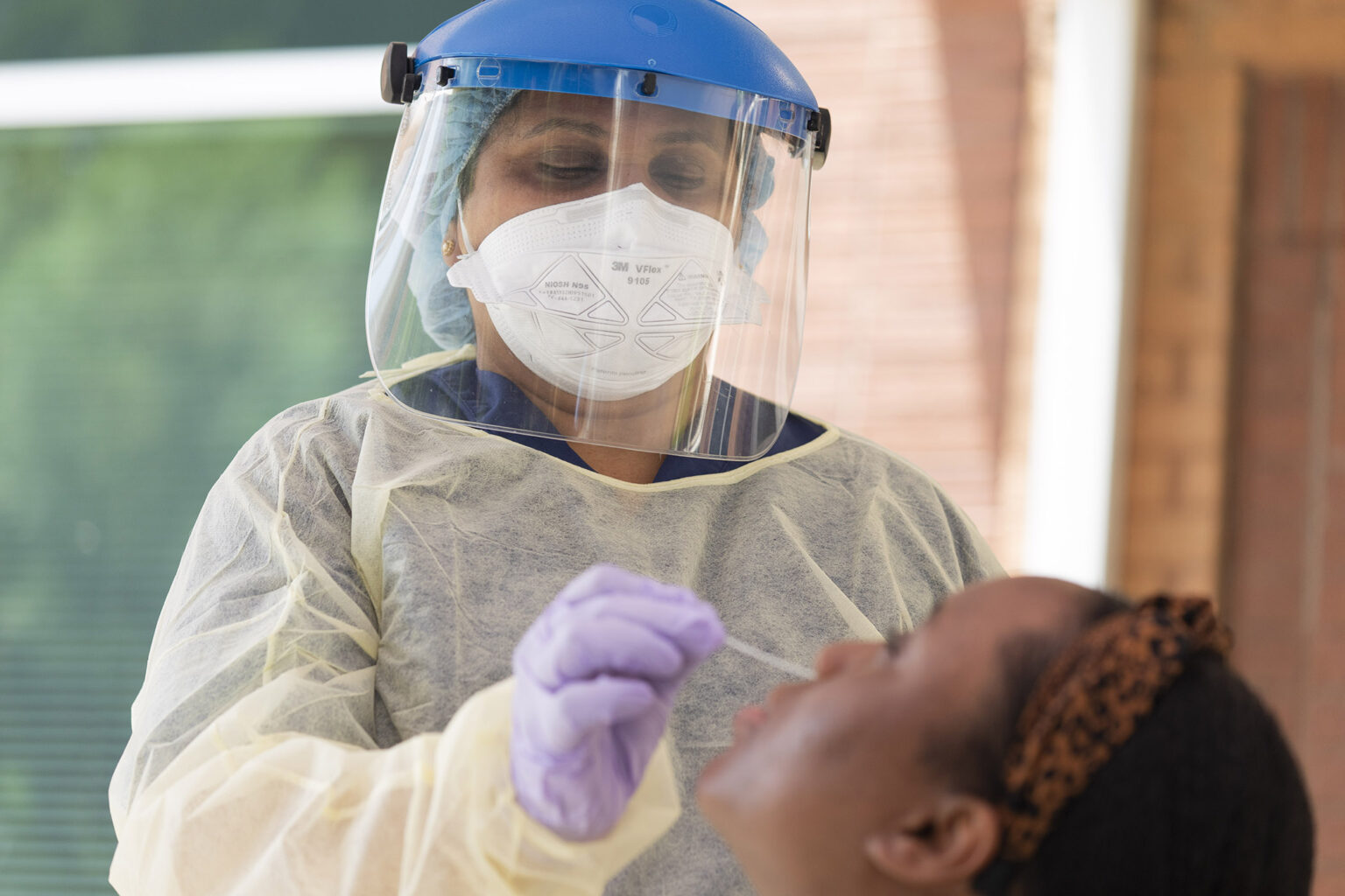 COVID-19 test being performed on a patient.