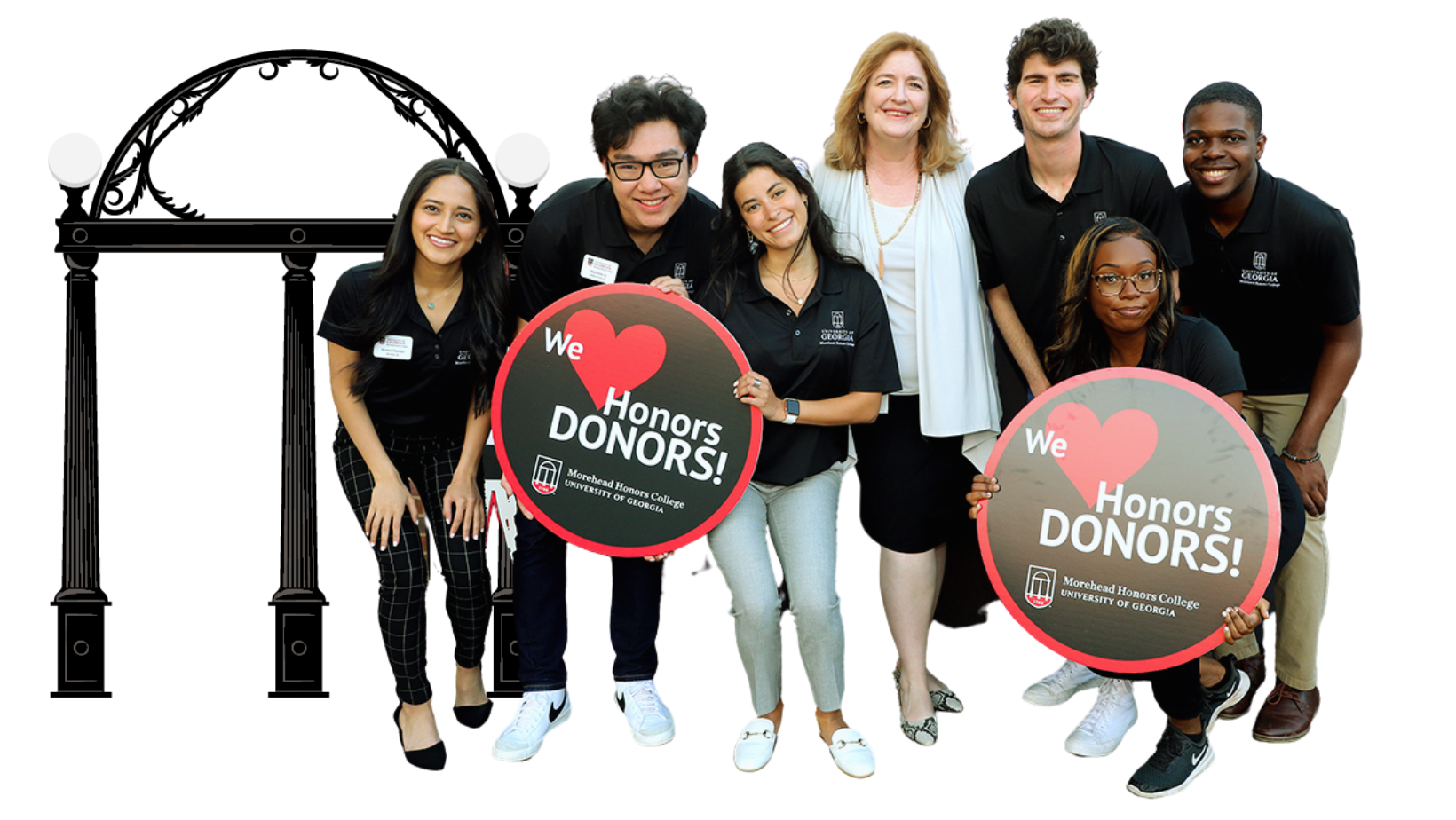 Dean Meg Amstutz with Morehead Honors College Ambassadors holding signs that read ''We love Honors donors!''