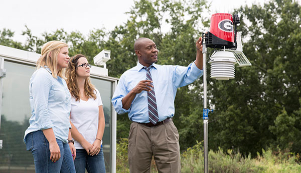 image of University of Georgia researcher Marshall Shepherd with students